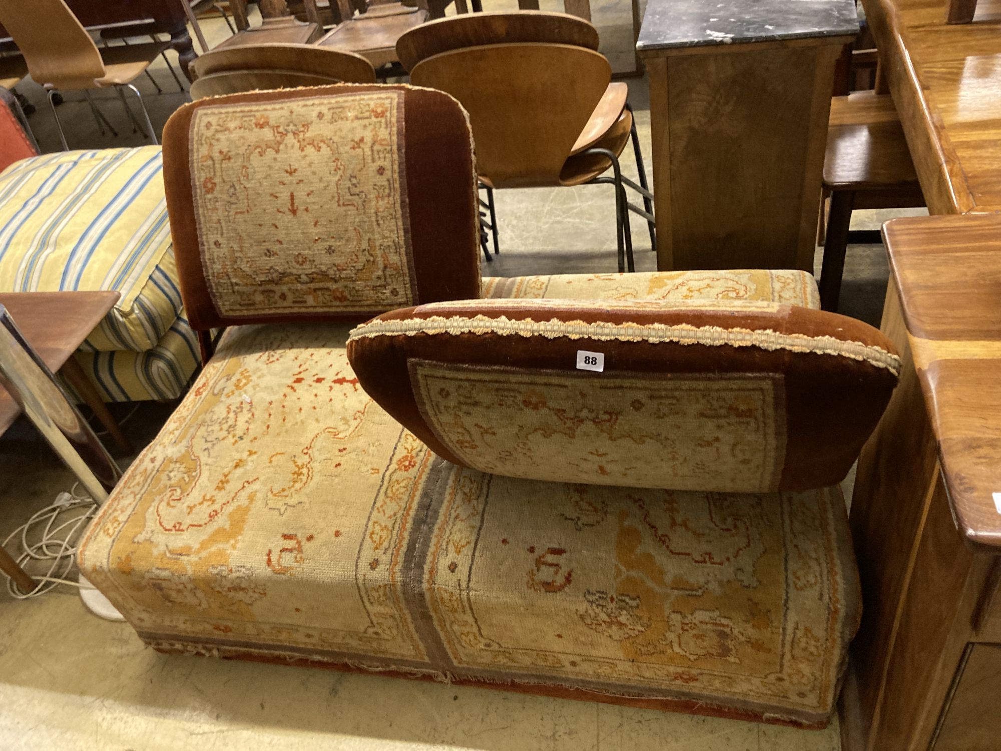 A Victorian carpet upholstered conversation seat with hinged adjustable back rests, length 134cm, depth 86cm, height 84cm